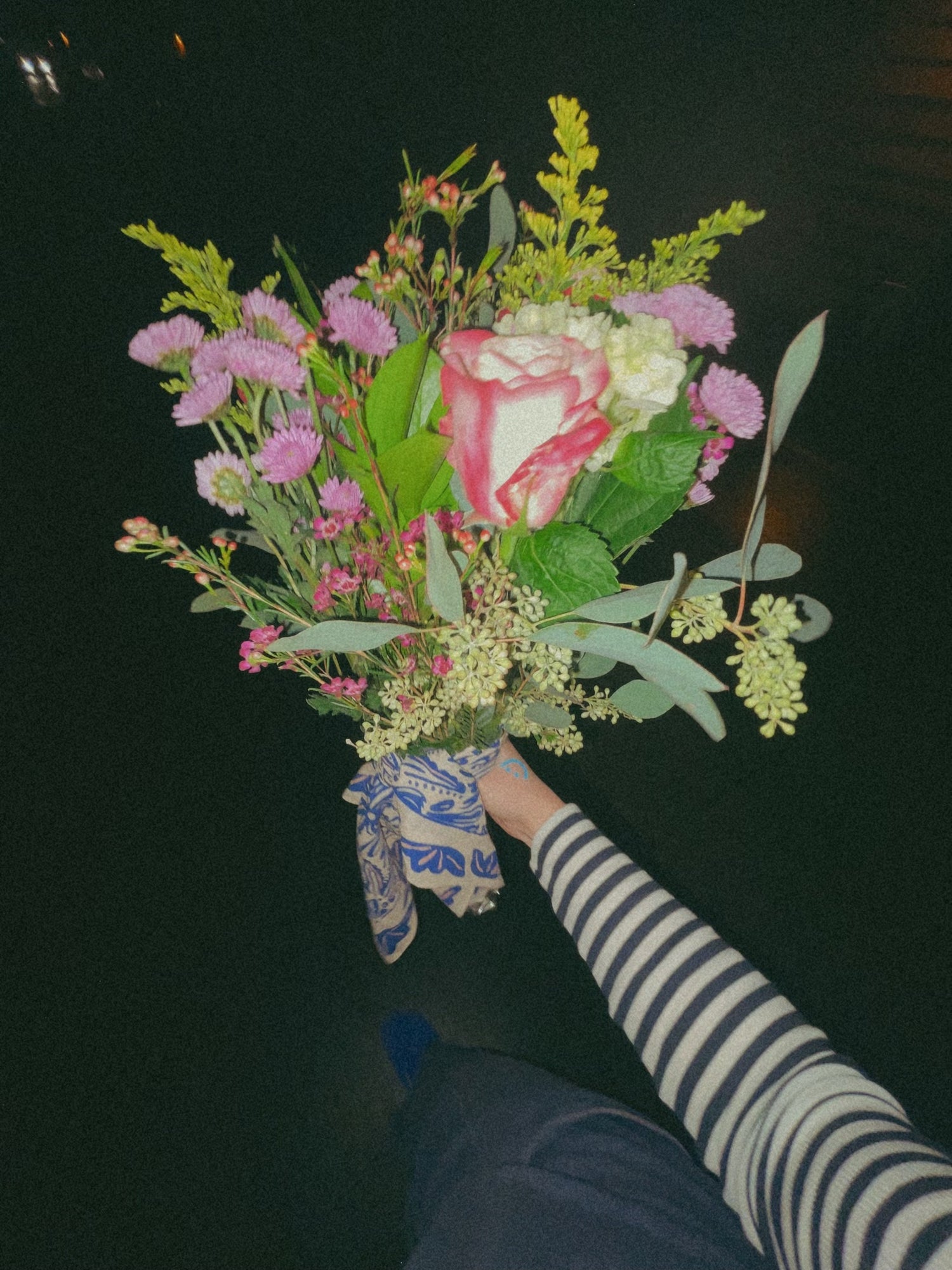 bouquet of flowers wrapped in the navy and tan sofia bandana