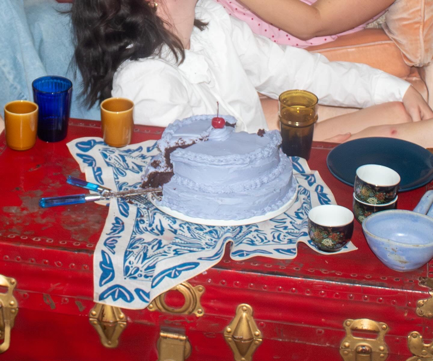 decorated, blue chocolate cake on a bandana textile spread